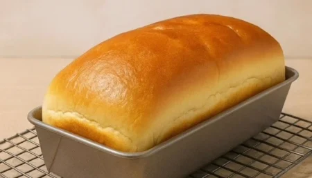 Freshly baked homemade bread on a wooden cutting board