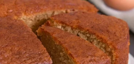 Slice of homemade flavourful banana cake with frosting